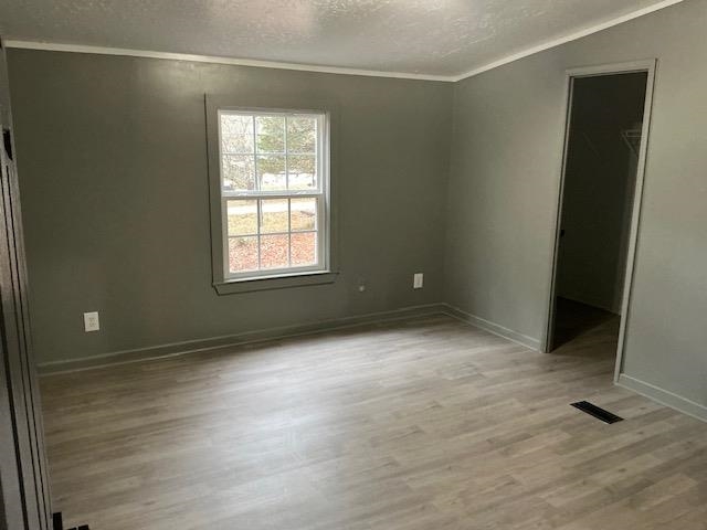 145 Walnut Bend Road Arlington, TN 38002 - Photo 5 of 9 an empty room with wooden floor and windows