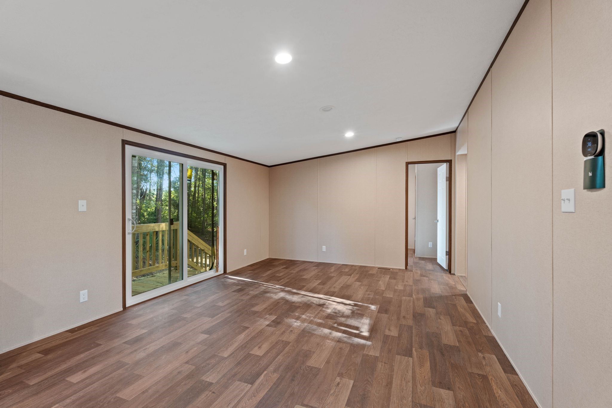 3941 Highline Oaks West Conroe, TX 77306 - Photo 11 of 38 a view of an empty room with wooden floor and a window