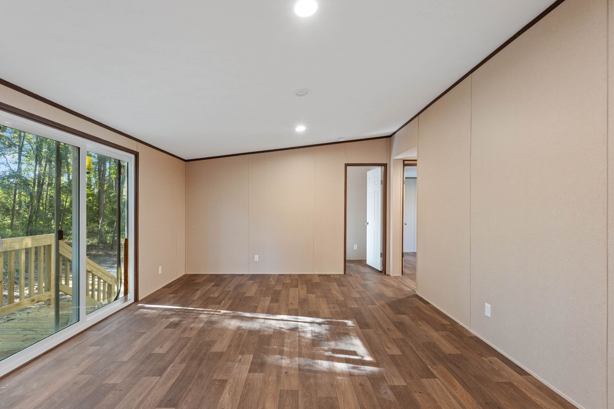 3941 Highline Oaks West Conroe, TX 77306 - Photo 12 of 38 a view of empty room with wooden floor and fan