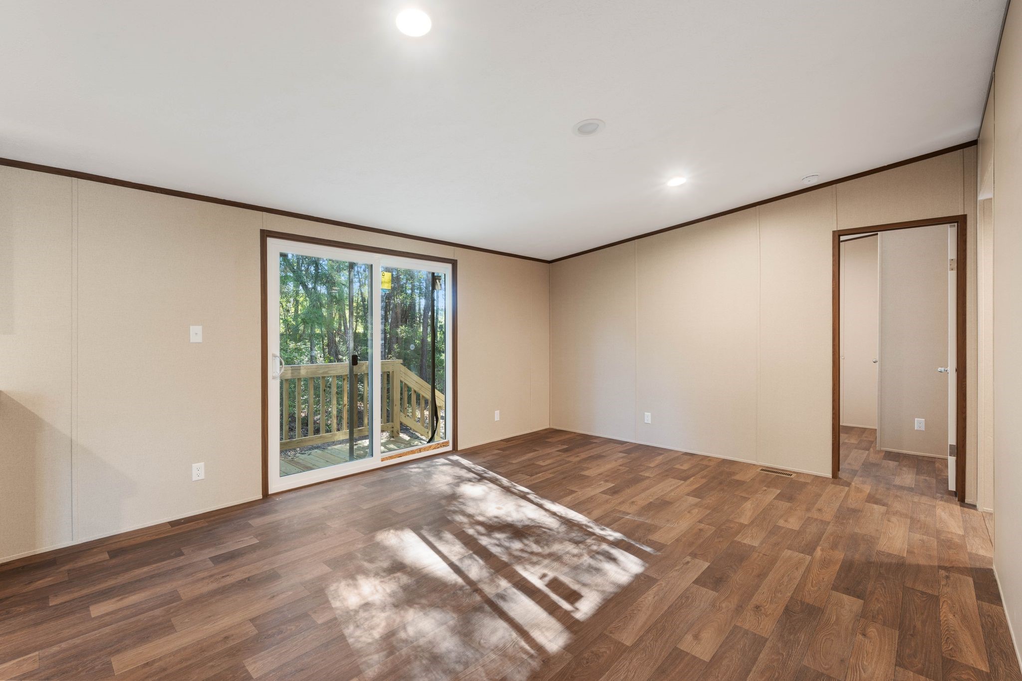 3941 Highline Oaks West Conroe, TX 77306 - Photo 13 of 38 a view of an empty room with wooden floor and a window