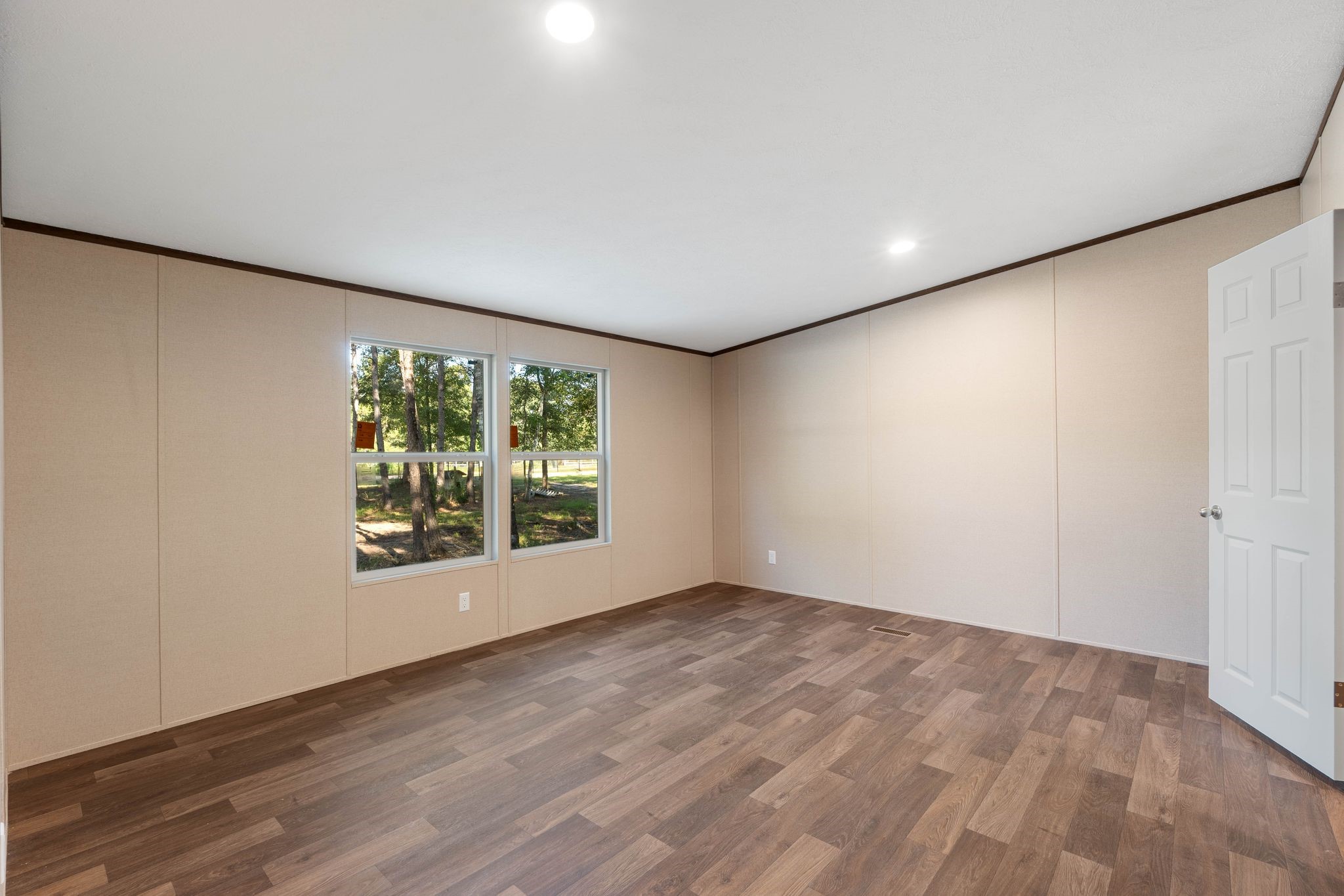 3941 Highline Oaks West Conroe, TX 77306 - Photo 14 of 38 a view of an empty room with wooden floor and a window