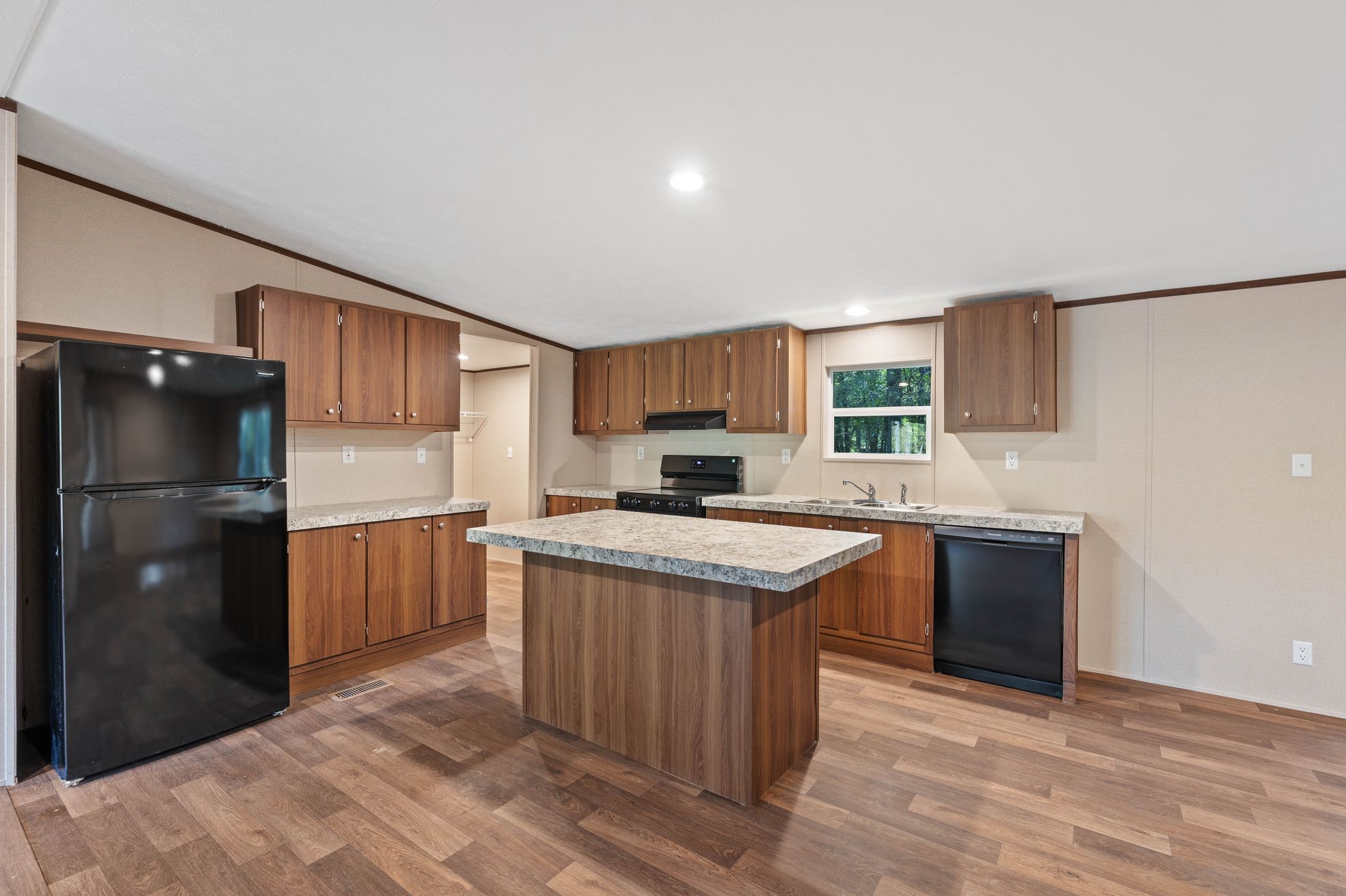 3941 Highline Oaks West Conroe, TX 77306 - Photo 7 of 38 a kitchen with a stove a refrigerator and a sink