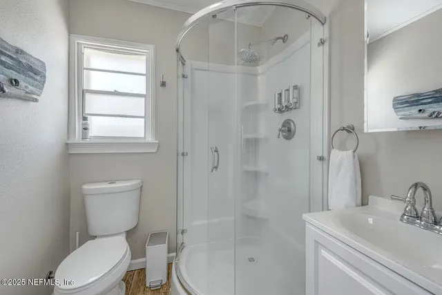 a view of a balcony with floor to ceiling windows with wooden floor