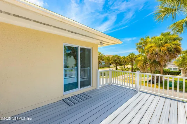 a view of a house with a tree and a garden