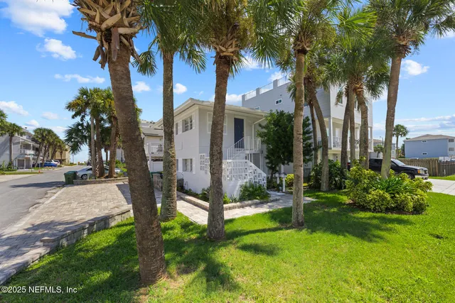 a view of a house with swimming pool and sitting area