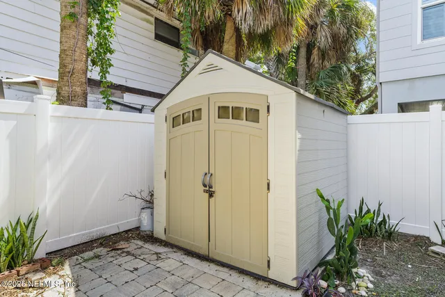 a view of a building with potted plants