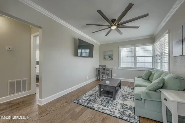 a living room with furniture and a window