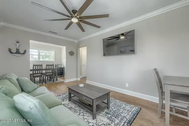 a living room with furniture and a window