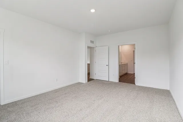 an empty room with closet area