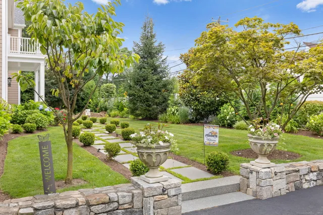a view of a garden with an outdoor seating