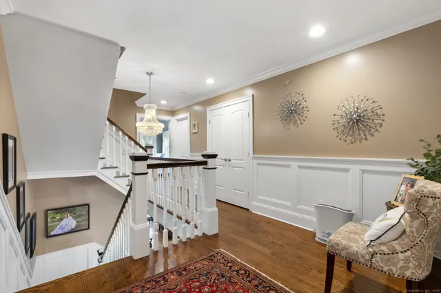 a view of entryway with furniture and wooden floor