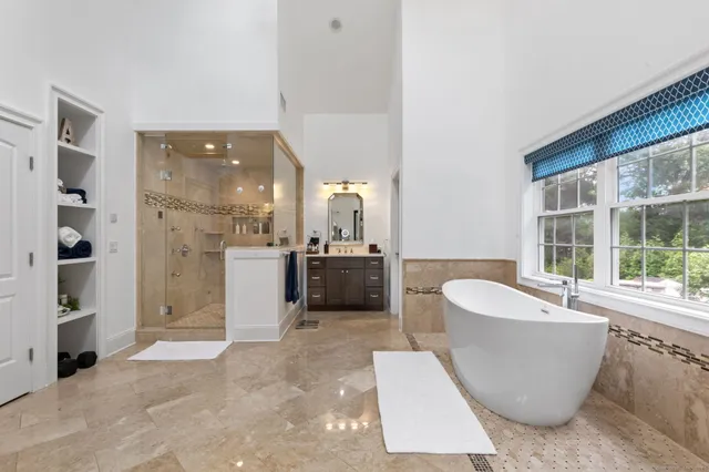 a living room with a couch and a large window