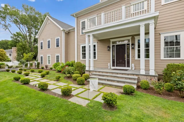 a front view of a house with a yard