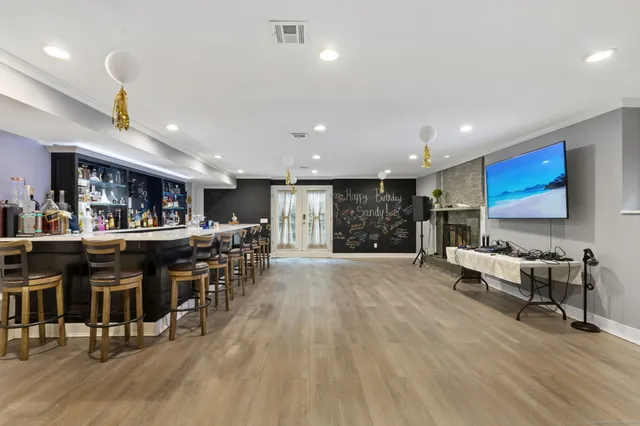 a living room with lots of furniture and kitchen view