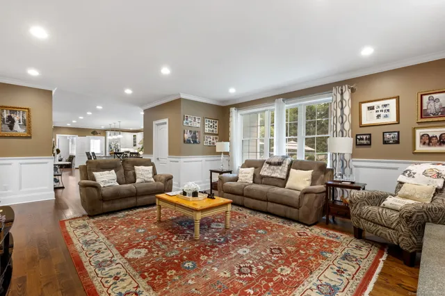 a living room with furniture and a rug