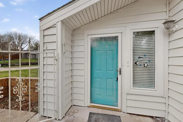 a view of a door and a window