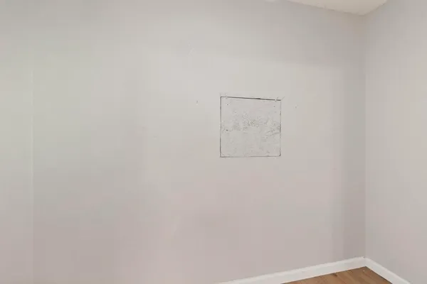 a view of a pathway with a wrought fence