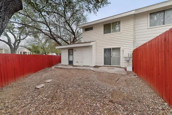 a house with trees in front of it