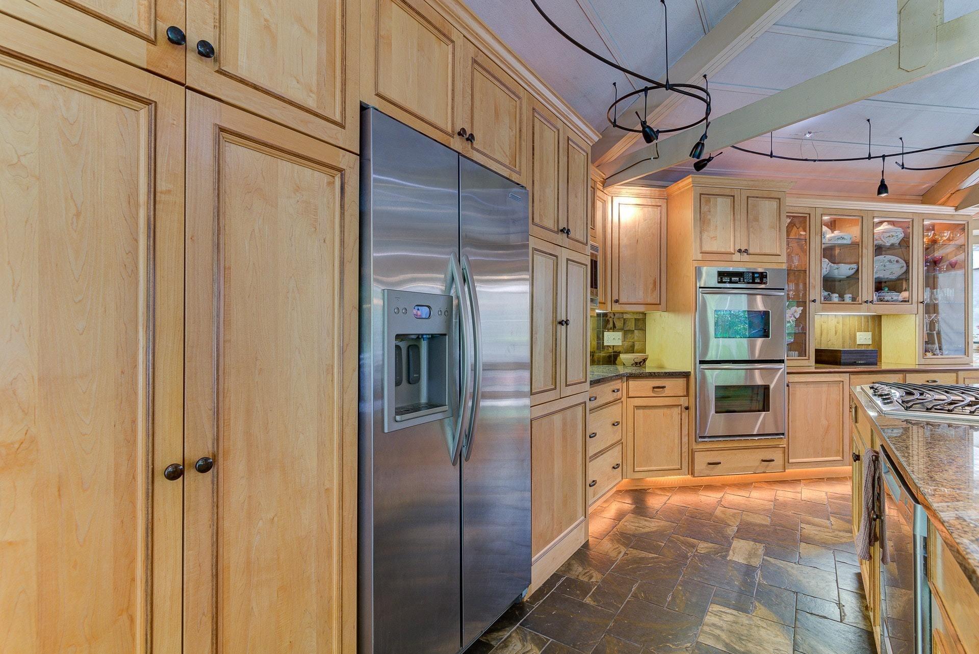 5459 Lakedale Road Southwest Roanoke, VA 24018 - Photo 22 of 69 a kitchen with stainless steel appliances granite countertop a refrigerator and a stove