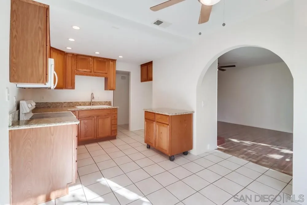 2157 Arnold Way, Unit 201 Alpine, CA 91901 - Photo 13 of 41 a kitchen with a sink and a refrigerator