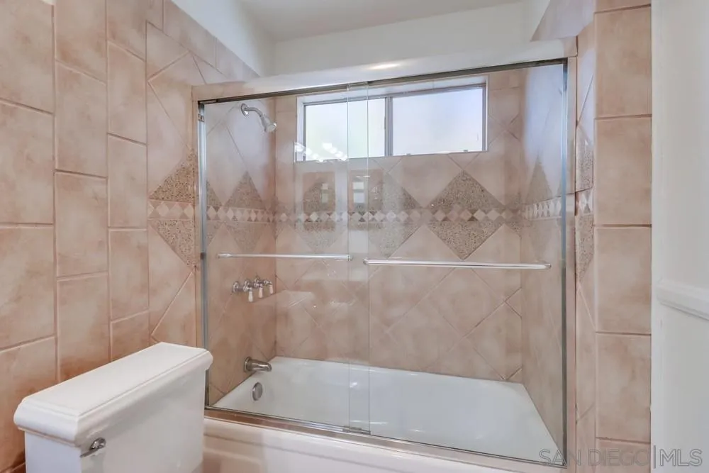 2157 Arnold Way, Unit 201 Alpine, CA 91901 - Photo 19 of 41 a bathroom with a bathtub and shower