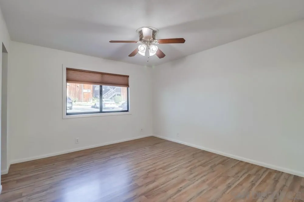 2157 Arnold Way, Unit 201 Alpine, CA 91901 - Photo 23 of 41 wooden floor in an empty room with a window