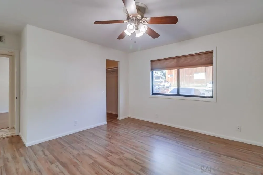 2157 Arnold Way, Unit 201 Alpine, CA 91901 - Photo 24 of 41 a view of an empty room with window and wooden floor