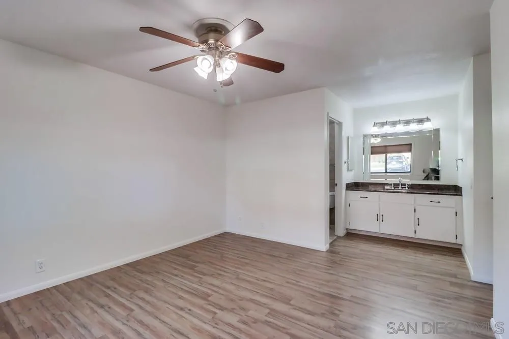 2157 Arnold Way, Unit 201 Alpine, CA 91901 - Photo 25 of 41 wooden floor in an empty room with a window