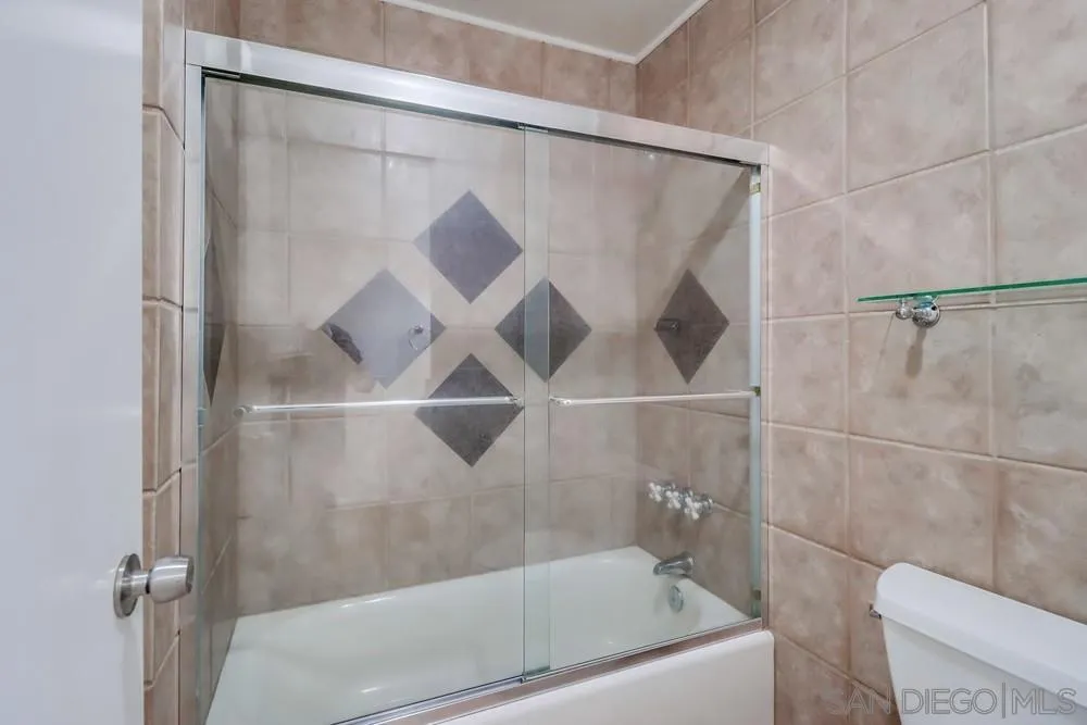 2157 Arnold Way, Unit 201 Alpine, CA 91901 - Photo 29 of 41 a bathroom with a bathtub and a shower