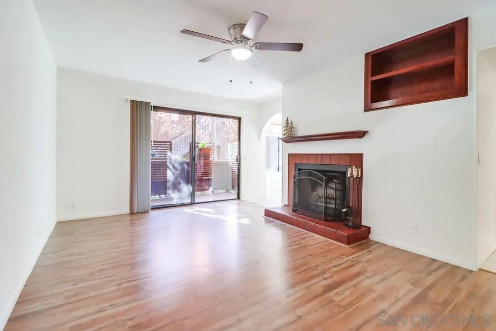 2157 Arnold Way, Unit 201 Alpine, CA 91901 - Photo 8 of 41 a view of an empty room with a window and fireplace
