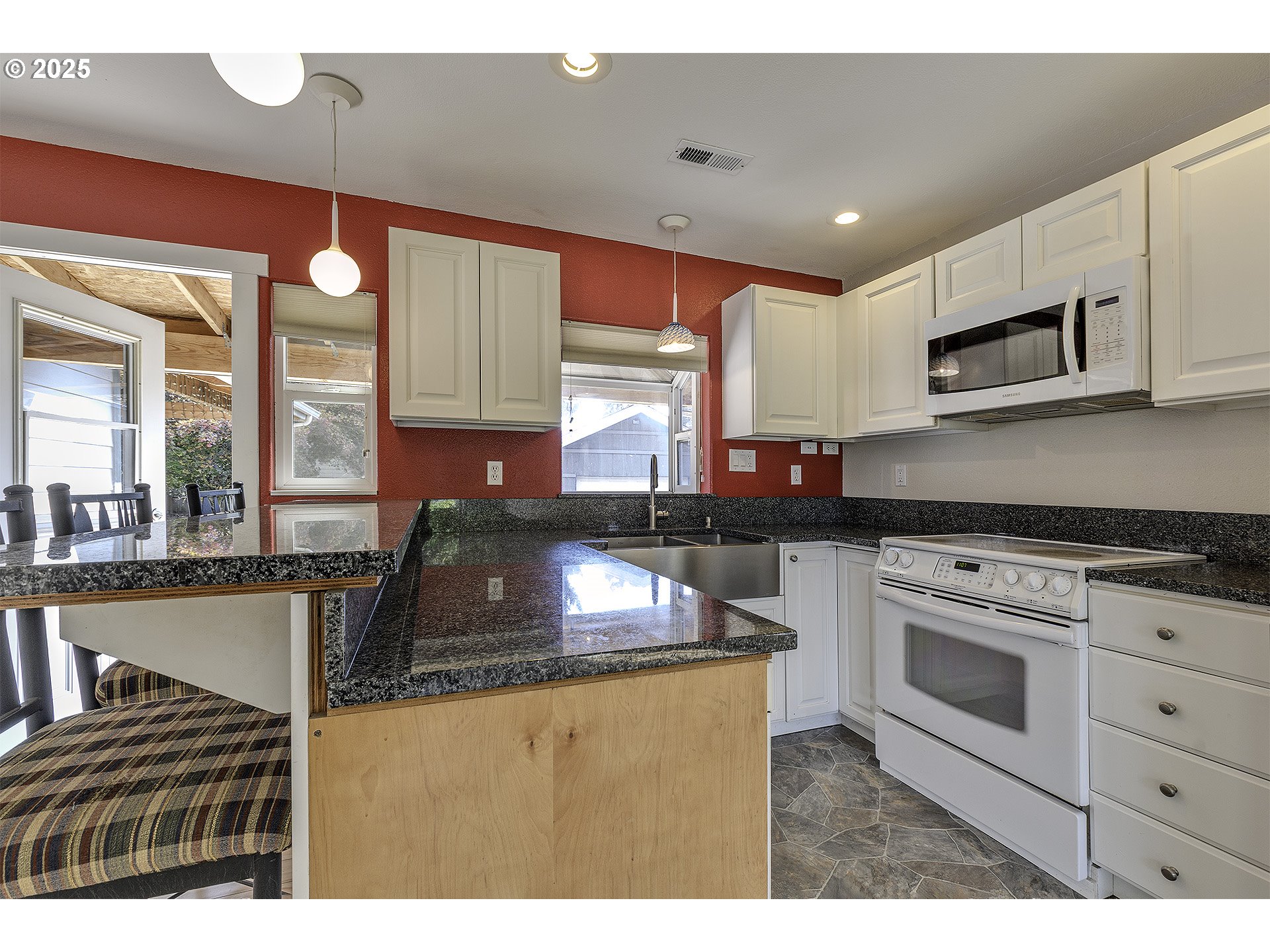 2319 Hawthorne Street Forest Grove, OR 97116 - Photo 11 of 33 a kitchen with stainless steel appliances granite countertop a stove a sink and a microwave