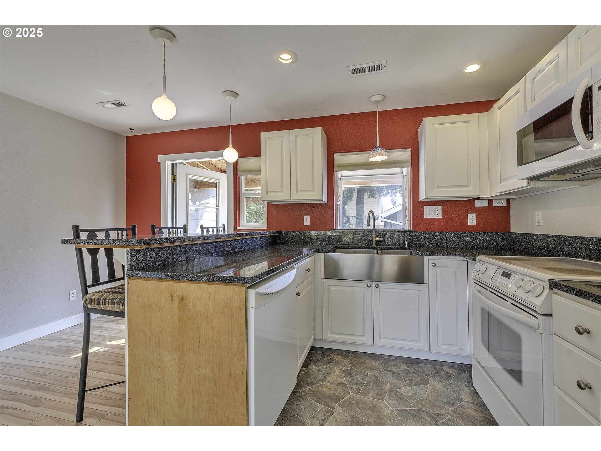 2319 Hawthorne Street Forest Grove, OR 97116 - Photo 12 of 33 a kitchen with stainless steel appliances granite countertop a stove a sink and a refrigerator