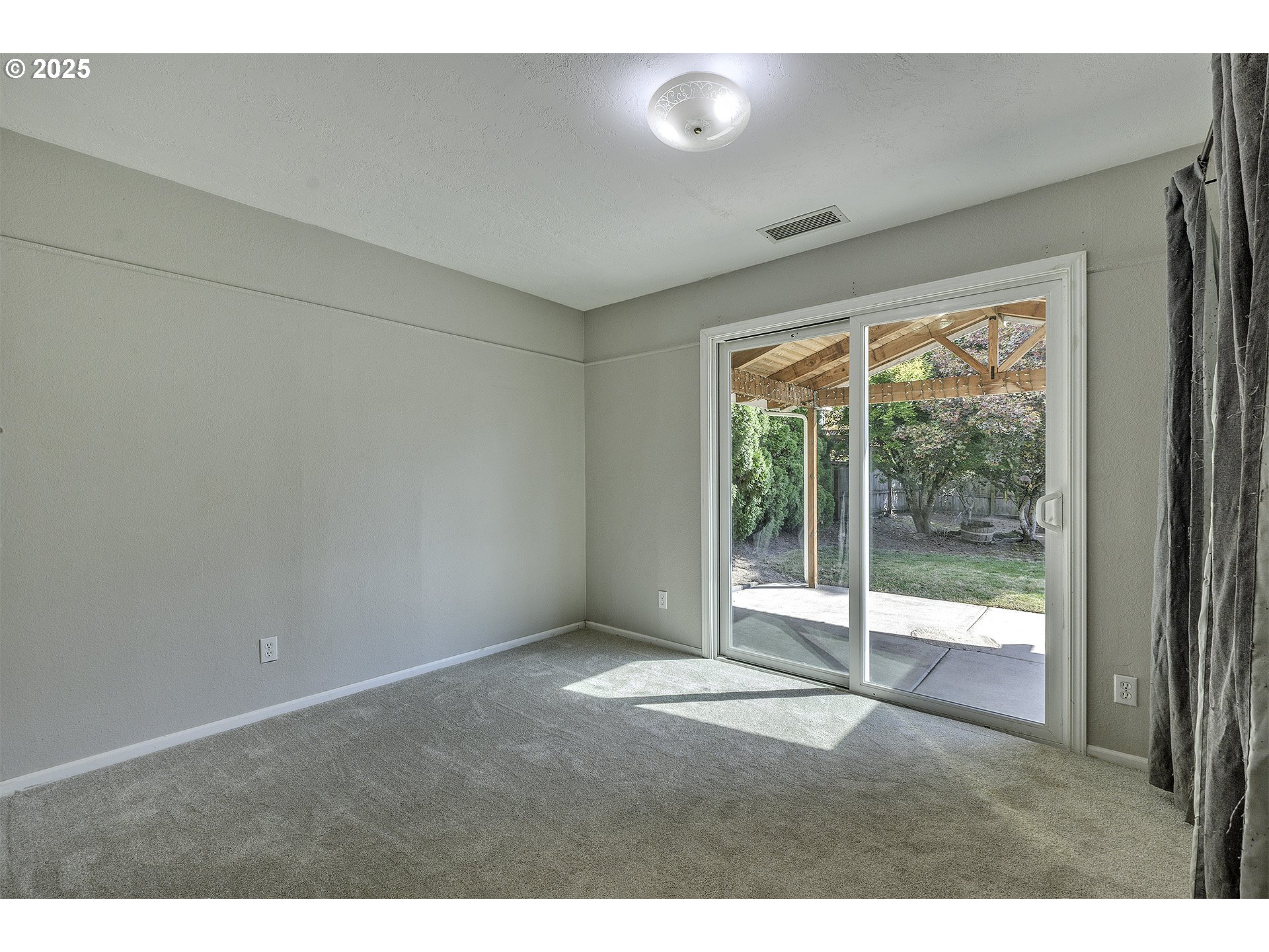 2319 Hawthorne Street Forest Grove, OR 97116 - Photo 14 of 33 a view of an empty room with wooden floor and a window