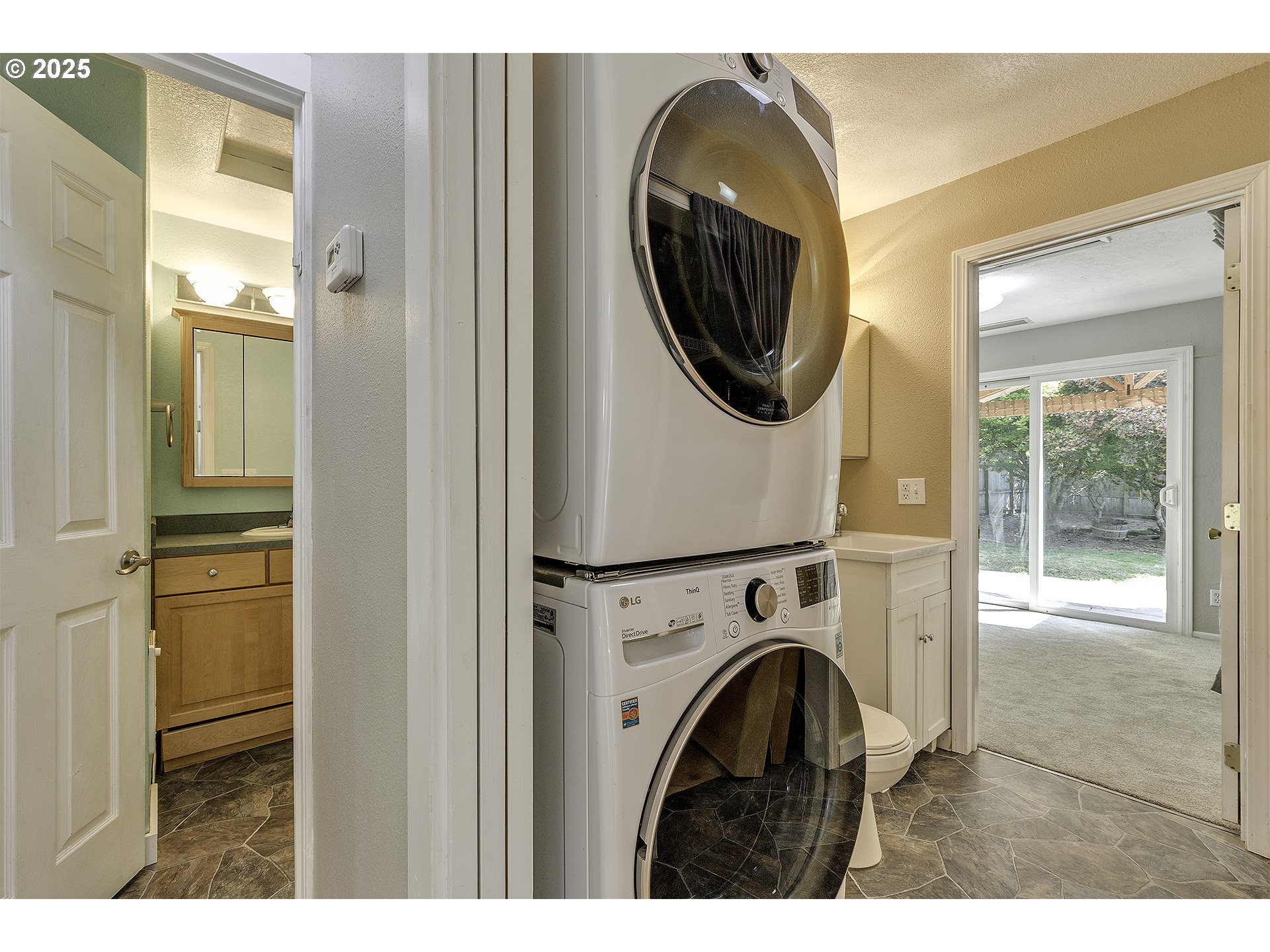 2319 Hawthorne Street Forest Grove, OR 97116 - Photo 17 of 33 a view of a hallway with washer and dryer