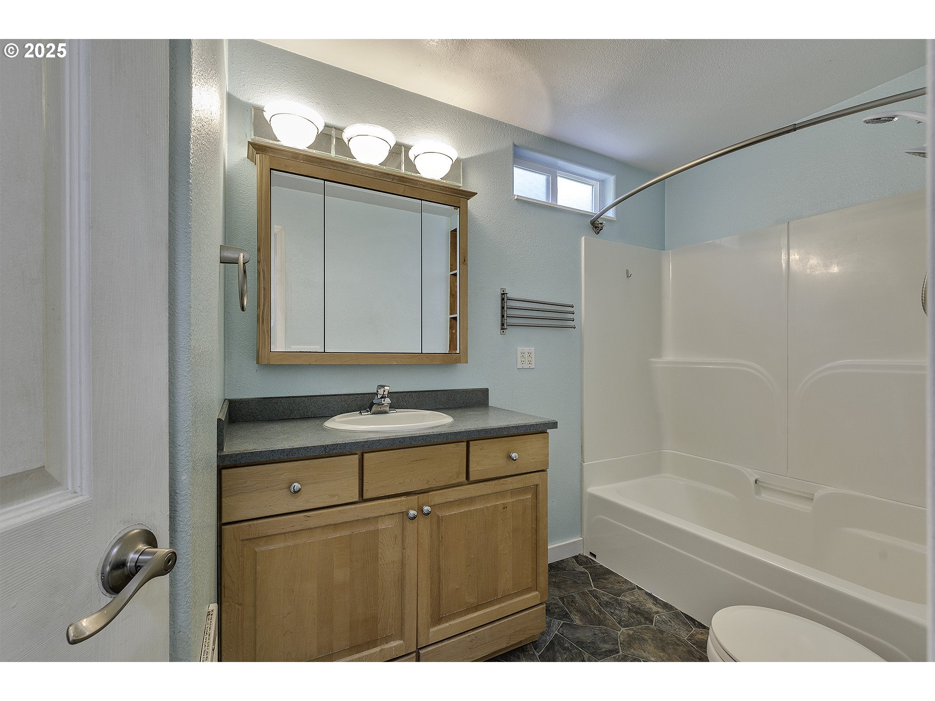 2319 Hawthorne Street Forest Grove, OR 97116 - Photo 19 of 33 a bathroom with a sink a toilet a mirror and shower