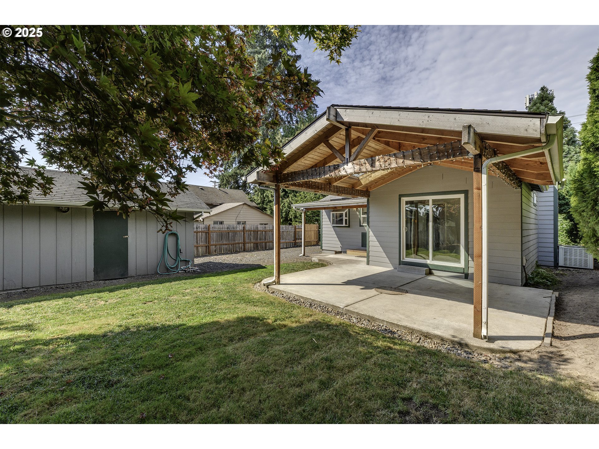 2319 Hawthorne Street Forest Grove, OR 97116 - Photo 23 of 33 a backyard of a house with table and chairs