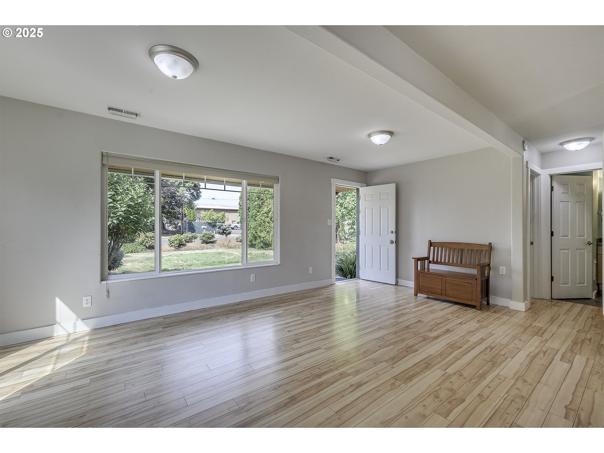 2319 Hawthorne Street Forest Grove, OR 97116 - Photo 4 of 33 a view of empty room with wooden floor and fan