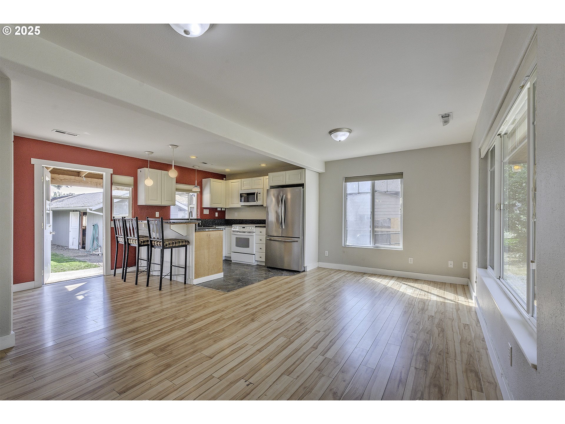 2319 Hawthorne Street Forest Grove, OR 97116 - Photo 6 of 33 a view of a kitchen with furniture and wooden floor