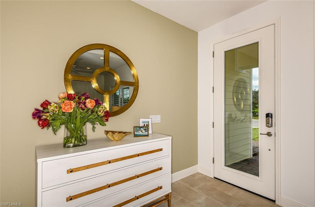 4048 Pegasus Way Naples, FL 34120 - Photo 12 of 13 a bathroom with a sink mirror and vanity