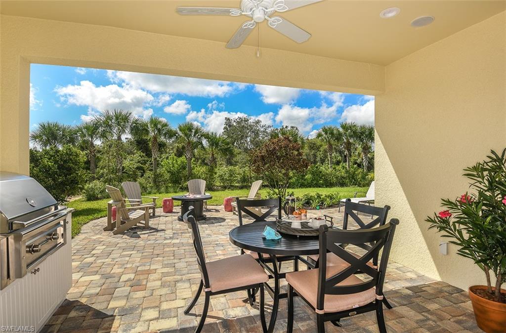 4048 Pegasus Way Naples, FL 34120 - Photo 13 of 13 a view of an outdoor dining space with a table and chairs