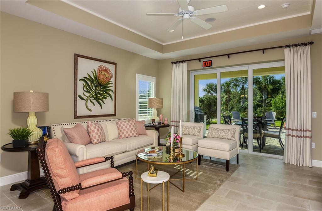 4048 Pegasus Way Naples, FL 34120 - Photo 2 of 13 a living room with furniture and a large window