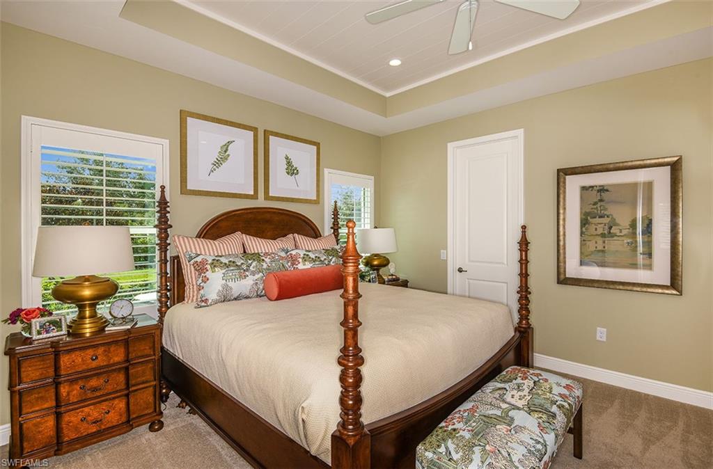 4048 Pegasus Way Naples, FL 34120 - Photo 8 of 13 a bedroom with a bed and wooden floor