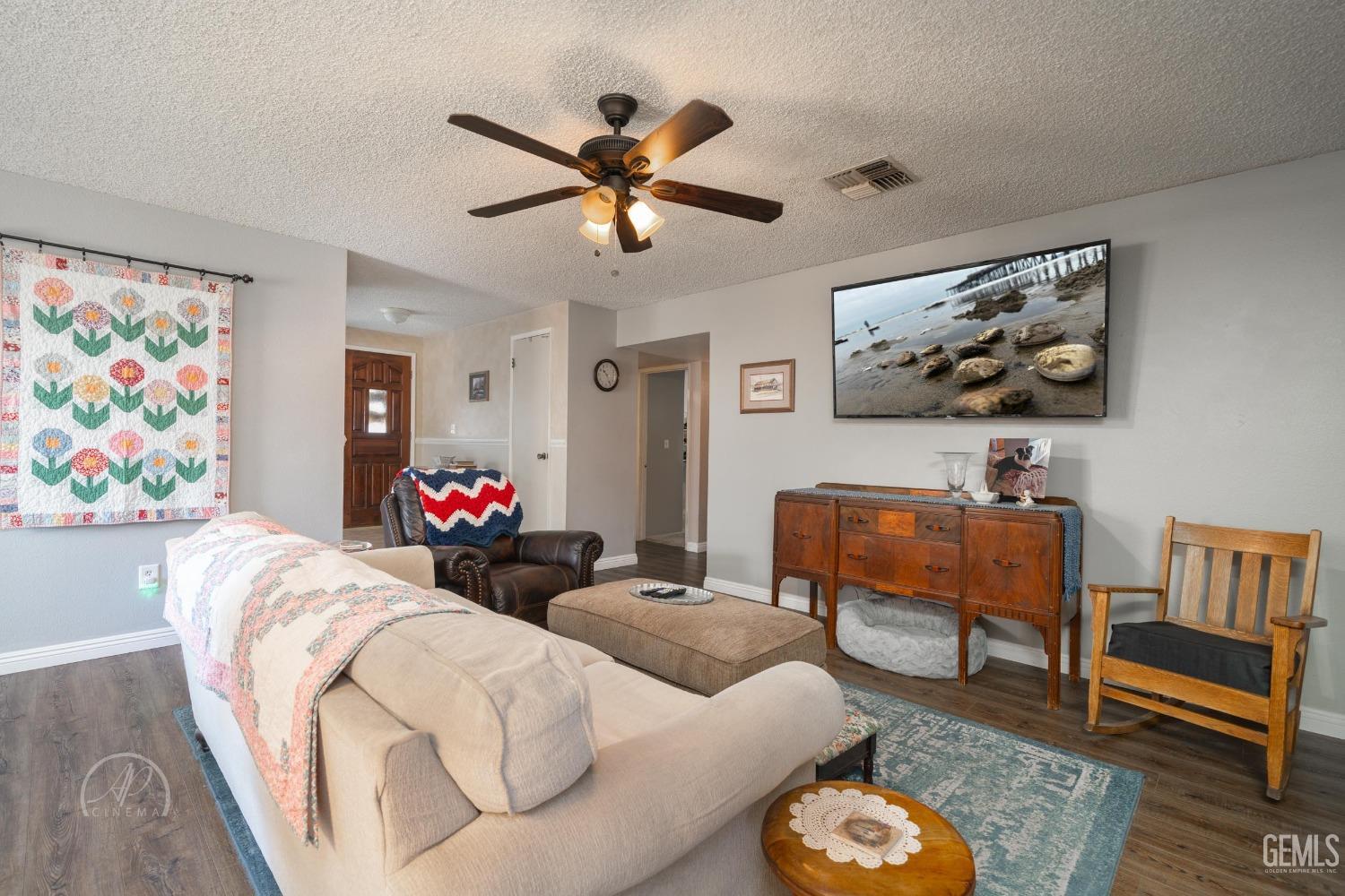 Undisclosed Address Taft, CA 93268 - Photo 8 of 32 a living room with furniture and wooden floor