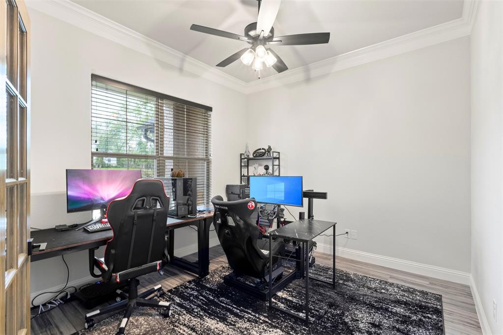 105 Clayton Crossing Springtown, TX 76082 - Photo 12 of 40 a view of a workspace with furniture and a window