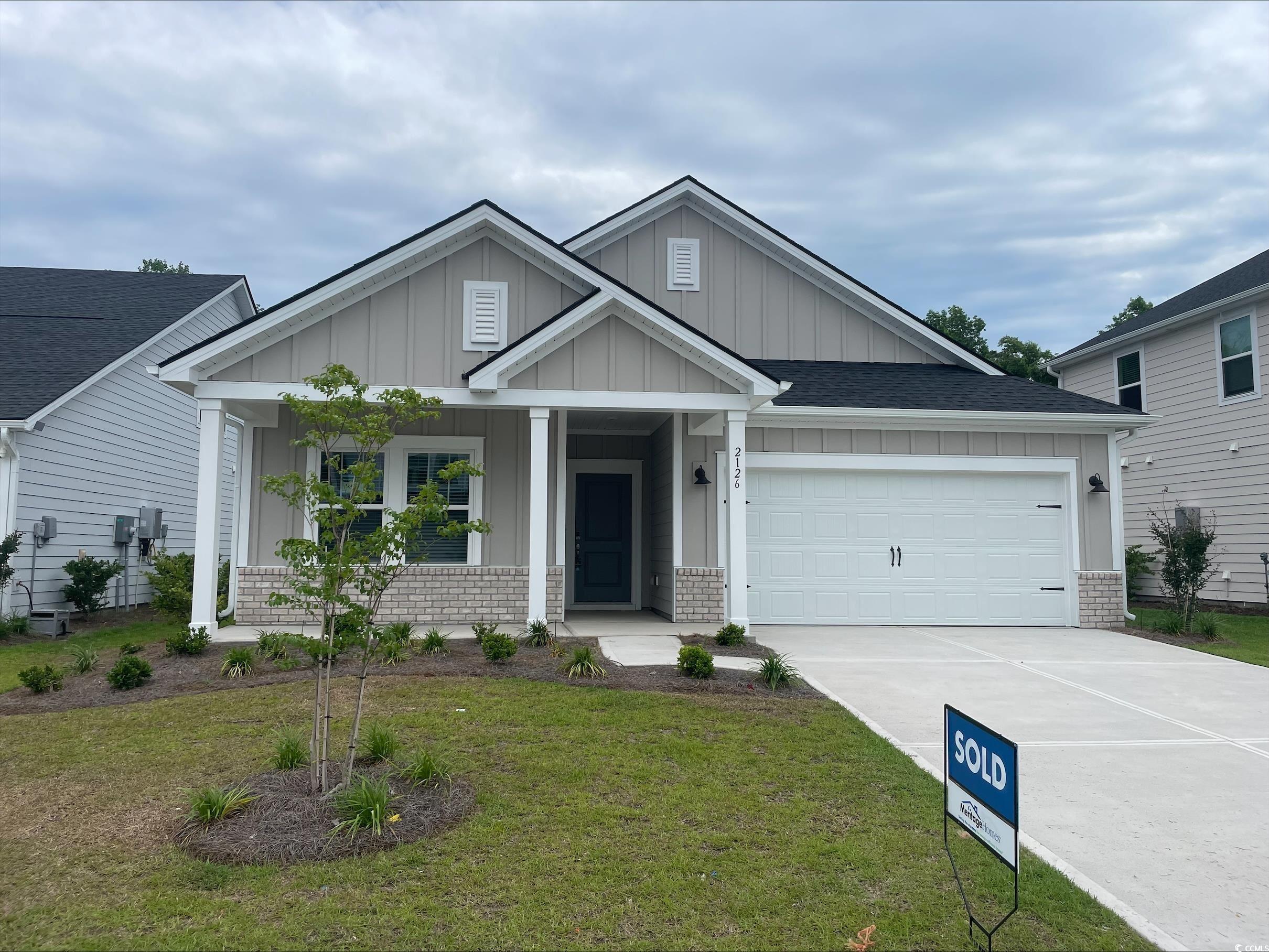 2126 Copper Crk Loop Longs, SC 29568 - Photo 1 of 4 Craftsman inspired home featuring covered porch, d