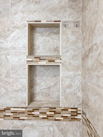 a bathroom with a toilet and a bathtub