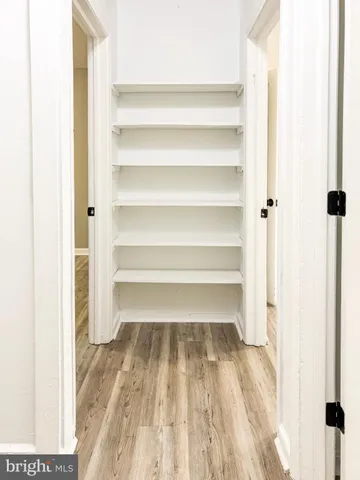 a view of a bathroom with wooden floor