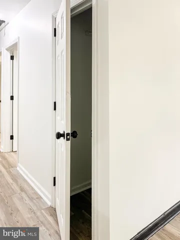a view of kitchen with granite countertop cabinets and wooden floor