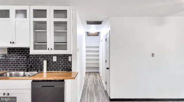 a bathroom with a sink and a shower