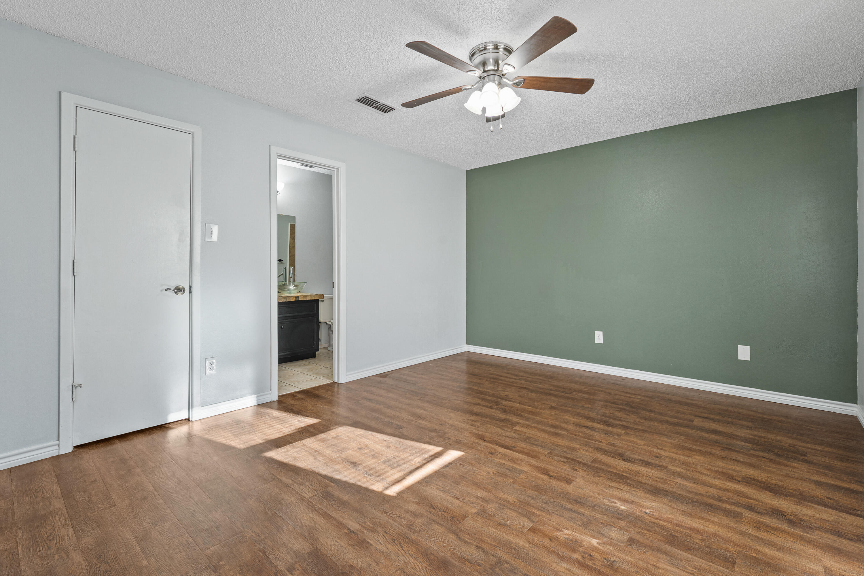 5705 Itasca Street Lubbock, TX 79416 - Photo 8 of 10 an empty room with fan and a ceiling fan
